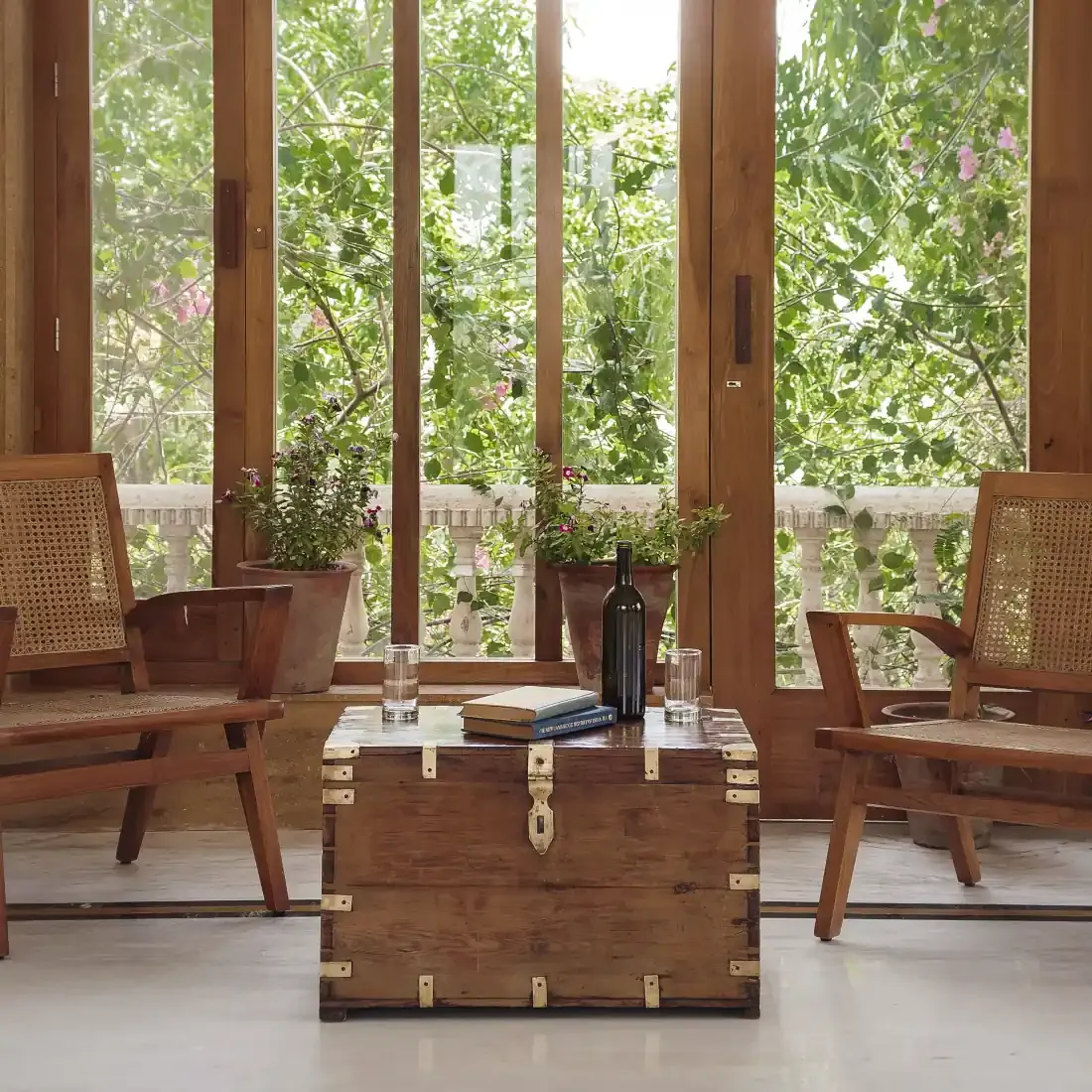 A quiet reading corner with books and garden views
