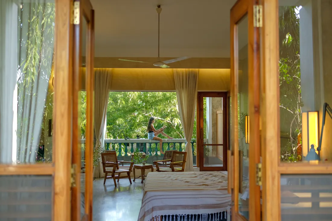 Through teak doors into the room