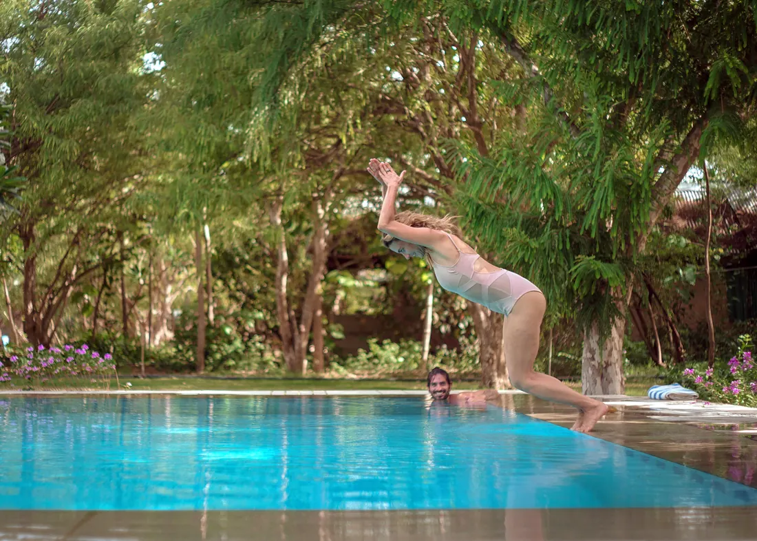 A guest diving into the pool