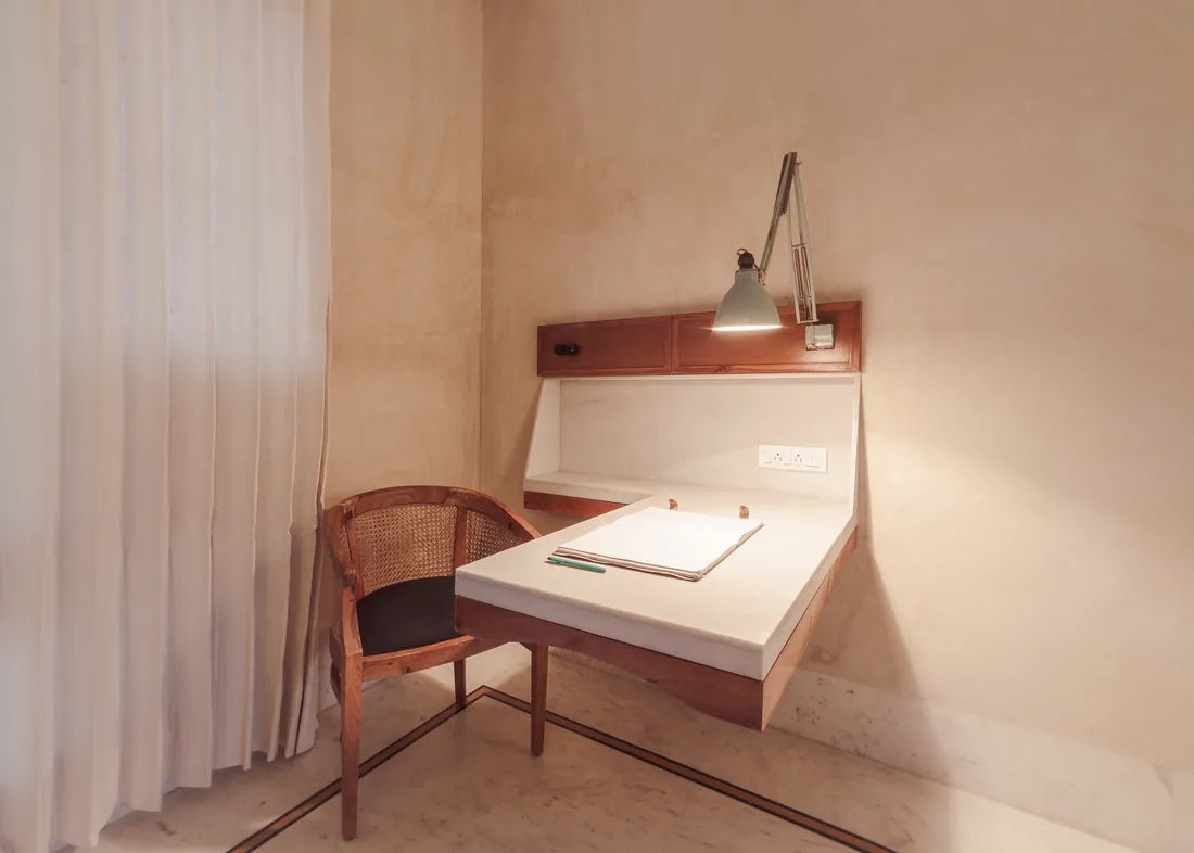 Built-in stone writing desk with an adjustable reading lamp