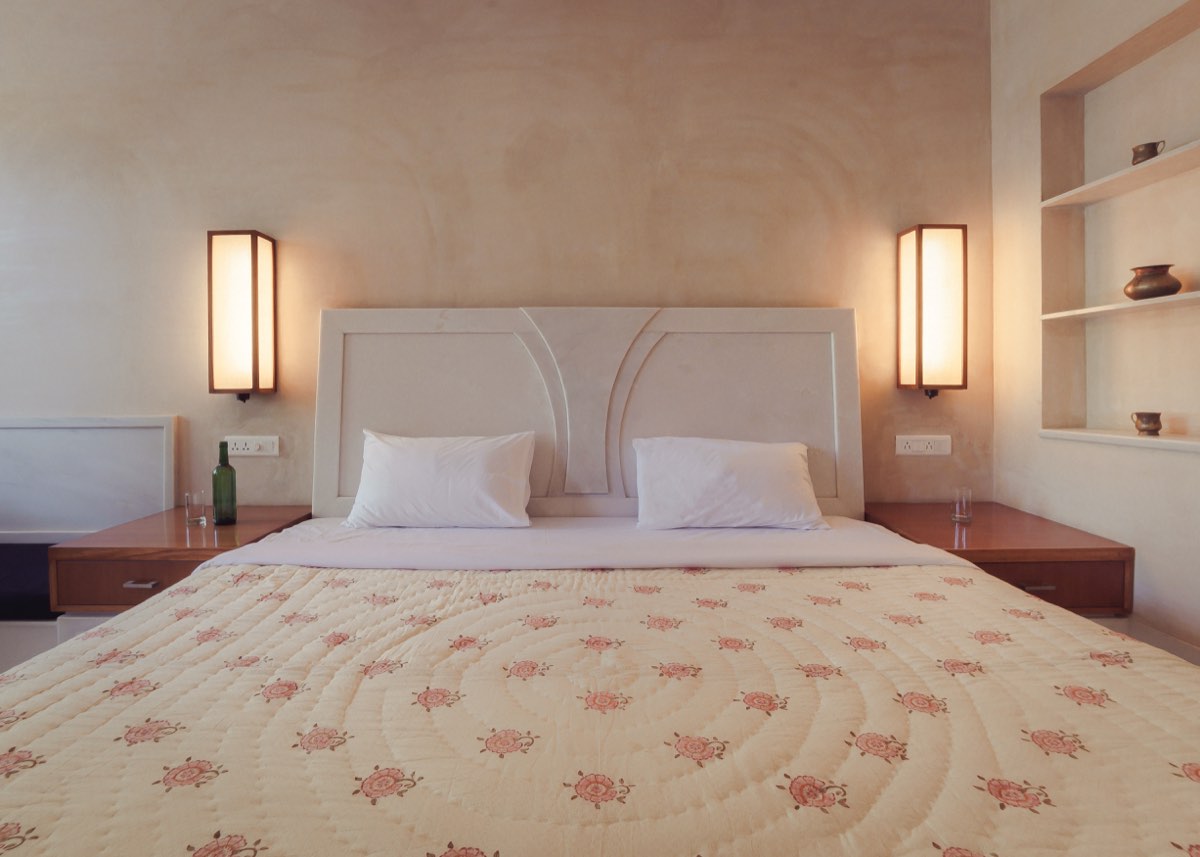 The bed and lit marble headboard