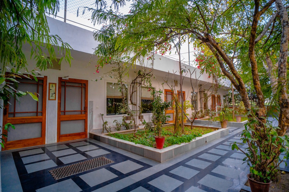 Room doors opening to the courtyard garden