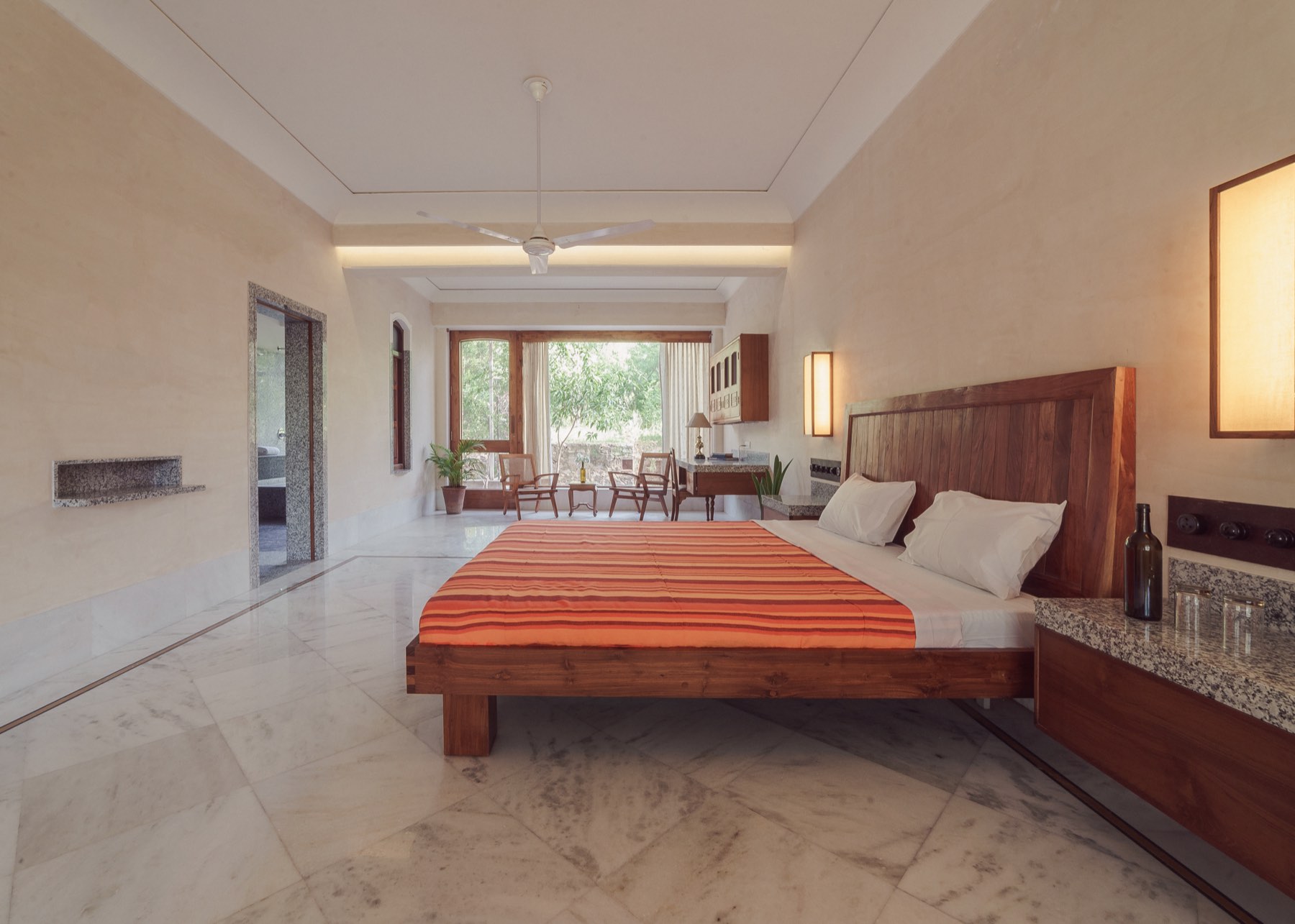 The Suite — the long room, marble floor, and the garden window